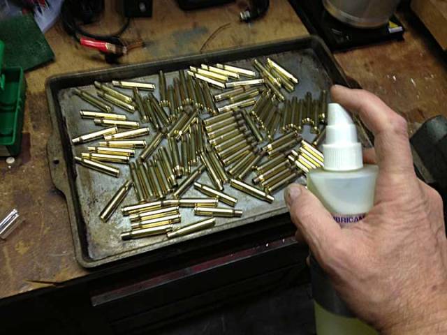 The cookie sheet and spray lube, roll your cases around the tray for a bit to ensure full coverage.