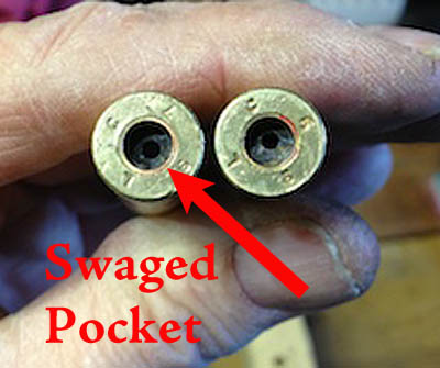 While hard to discern the difference in this image, the case on the left has been swaged, the one on the right still sports the crimp. The most obvious sign of this is the presence of more red primer sealant.