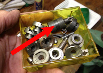 Sorry about this image, It's the only one I found quickly..  Stick the small end in the primer pocket and twist 'til it moves freely.