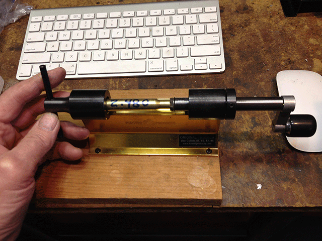 Showing insertion of standard case into trimmer