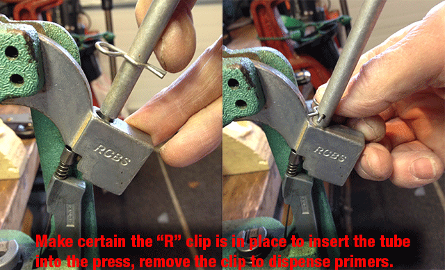 Shows insertion of primer feed tube into the press.