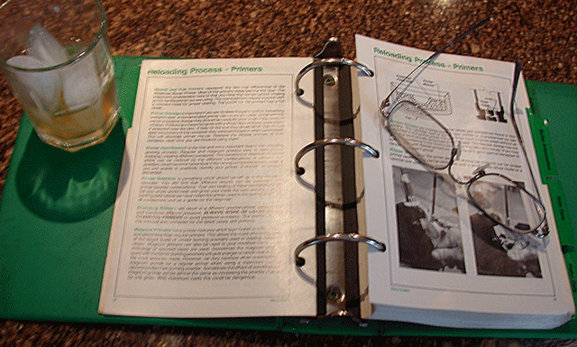 Showing reloading manual being read