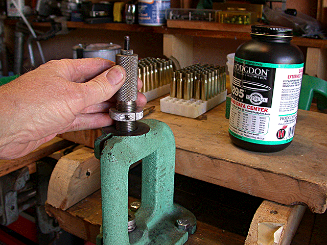 showing beginning insertion of seating die.