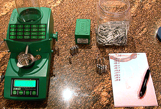 Showing weighing of 20 cast bullets to determine the average weight.