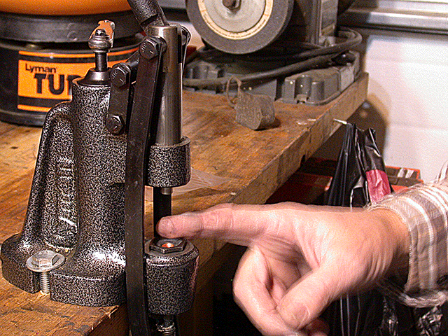 showing insertion of gas check into die