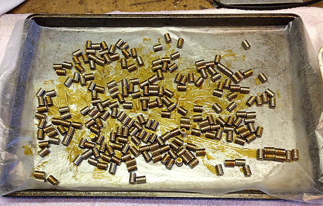showing lubed bullets drying on cookie tray lined with waxed paper